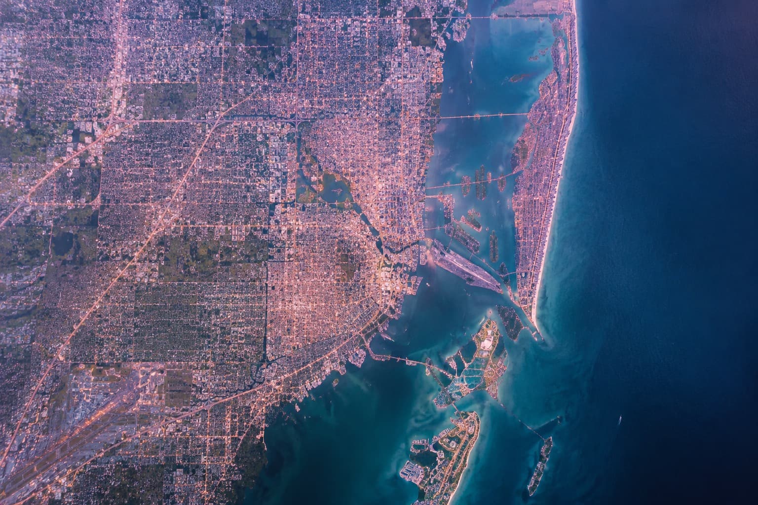 Aerial view of Miami-Dade, the bay and the barrier islands